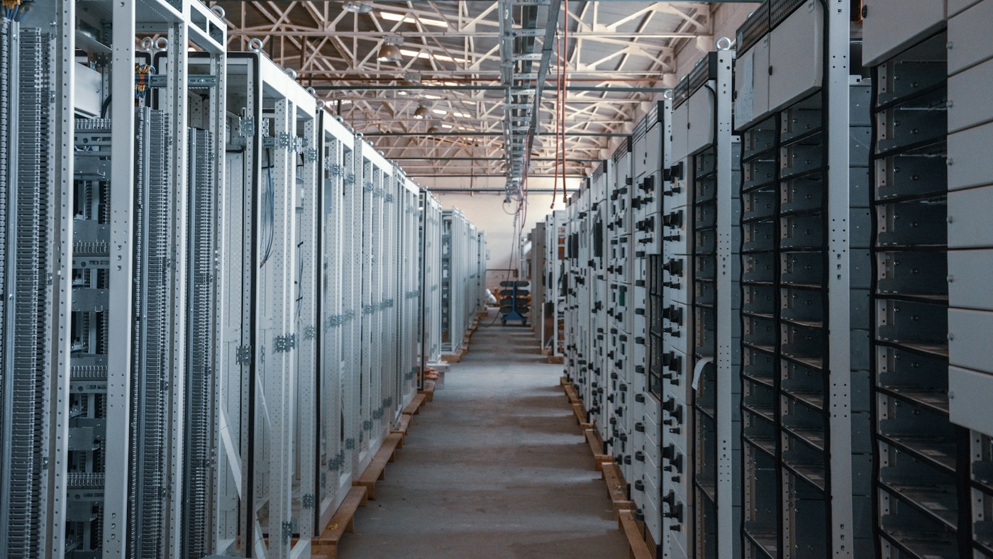 Aisle of equipment racks in a data center