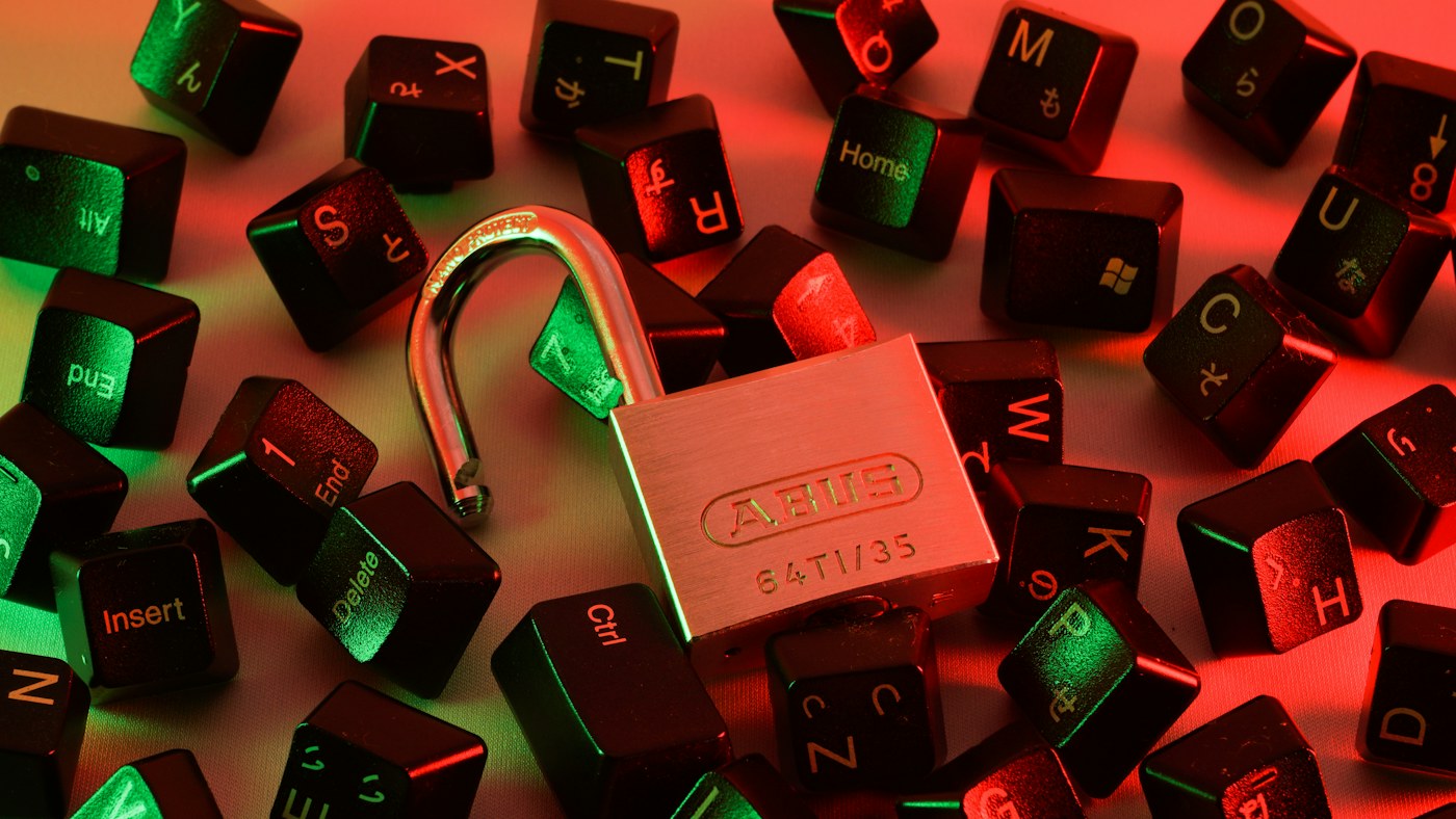 Padlock surrounded by computer keyboard keys