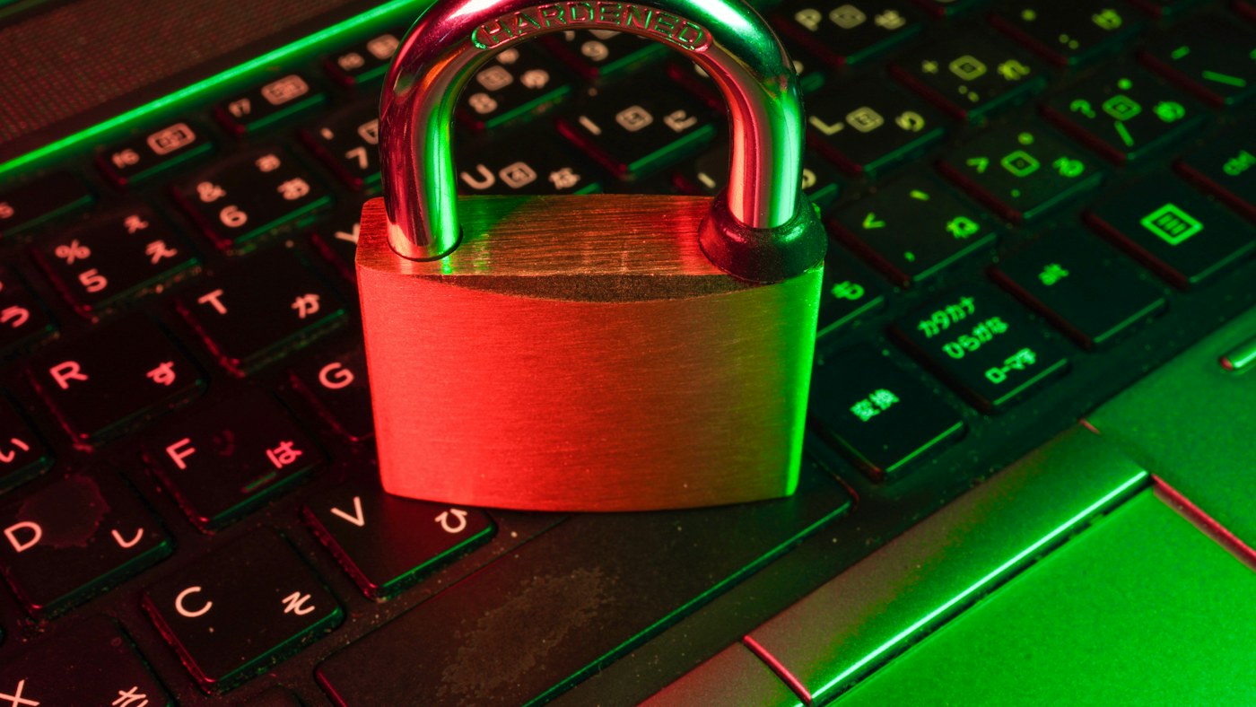 Padlock on a keyboard under red and green light