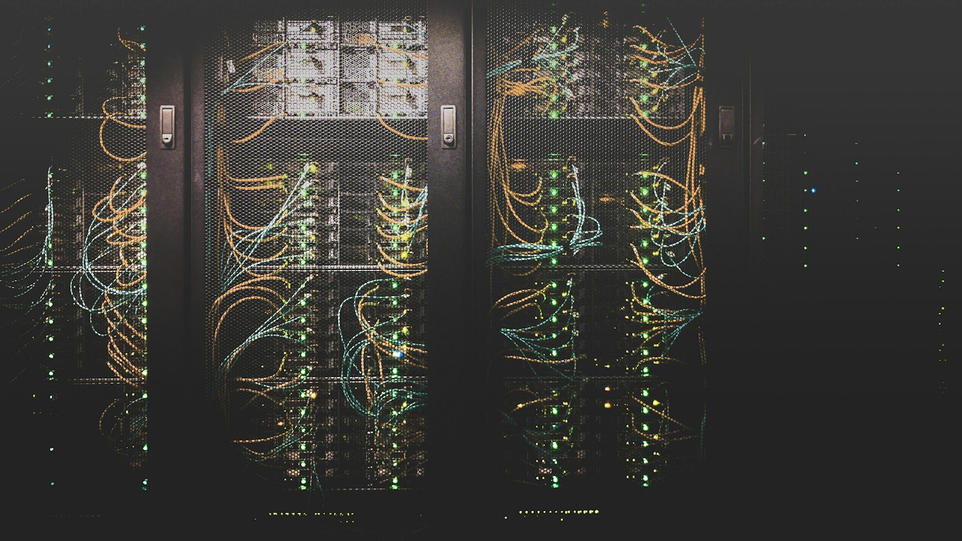 Network cables and server racks in a data center
