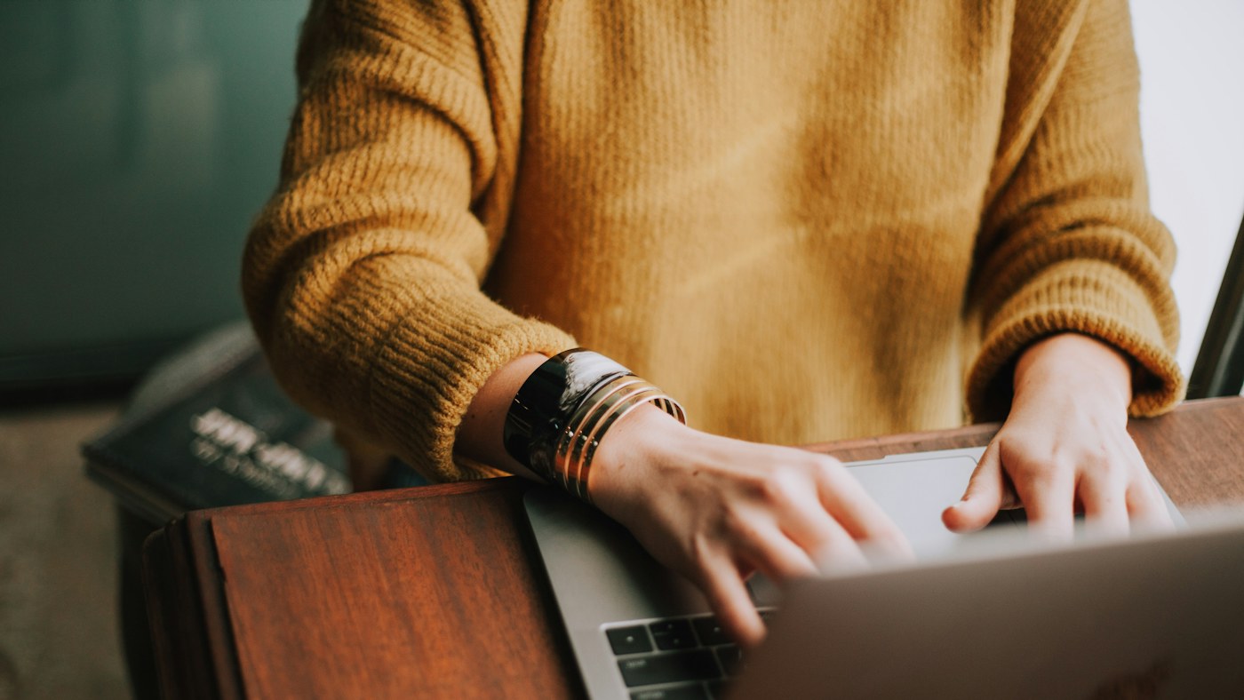 Person using a laptop at a desk